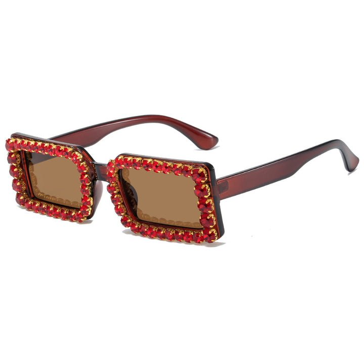 Dame moteriktig solbrille med glitrende rammedekorasjon Skanto