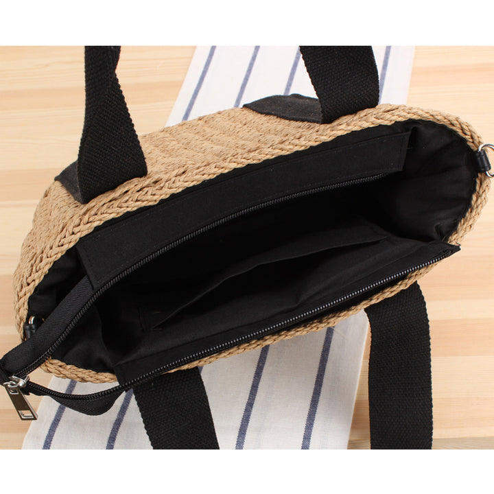 Handbag made of woven natural material with adjustable shoulder strap Skanto