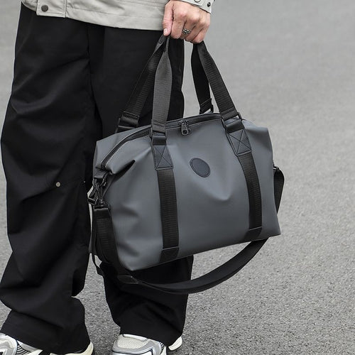 Sporty reiseveske med forsterket innvendig rom og avtakbar skulderstropp Skanto