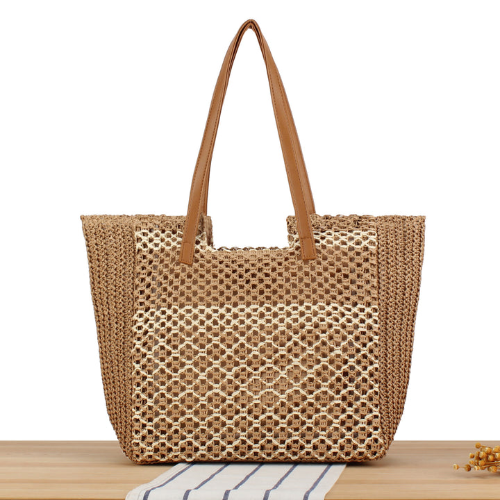 Tote bag made of woven natural material with elegant leather handles Skanto