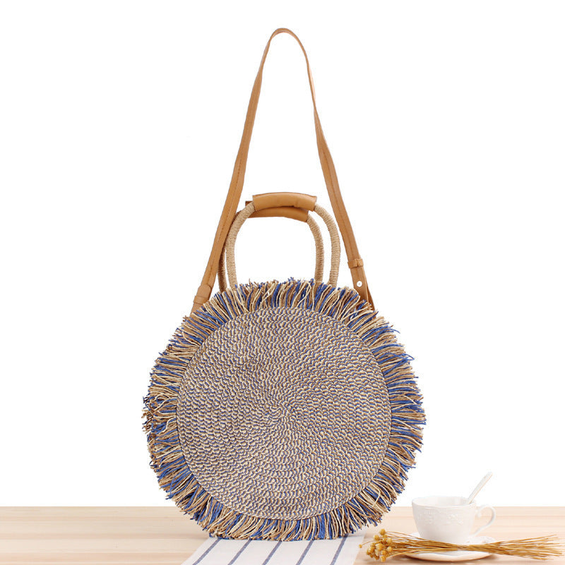 Round bag with fringe detail Made of braided material Skanto
