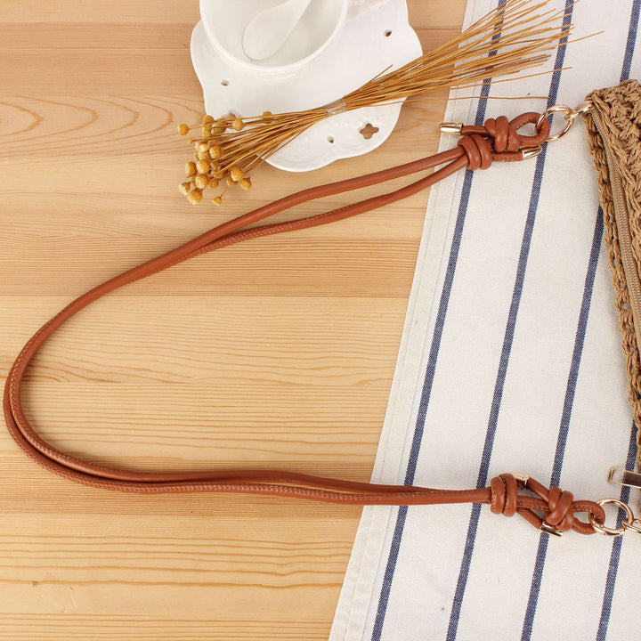 Handbag made of braided natural material with elegant button closure Skanto
