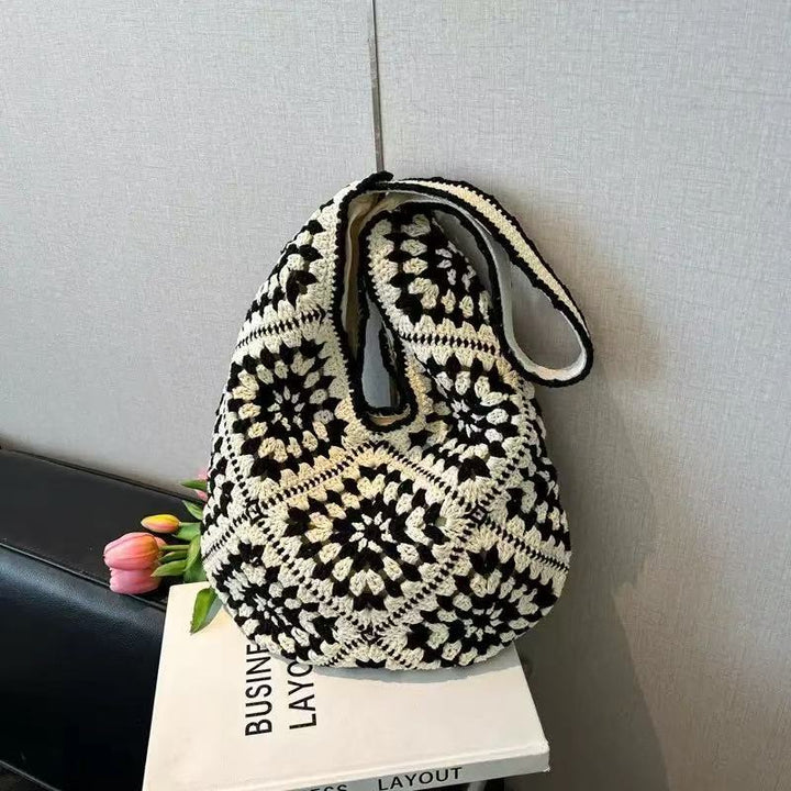 Håndknyttet skulderveske med florale motiver Skanto