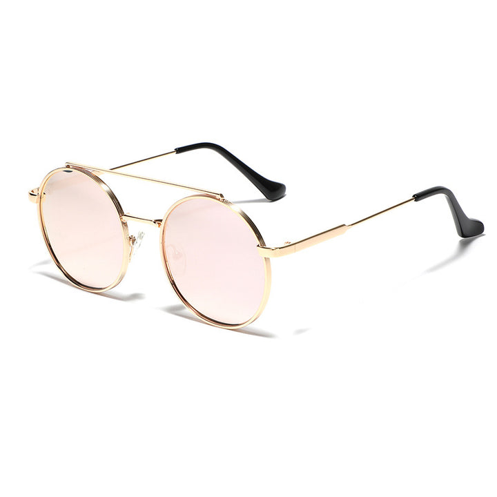 Dame rund solbrille med moteramme Skanto