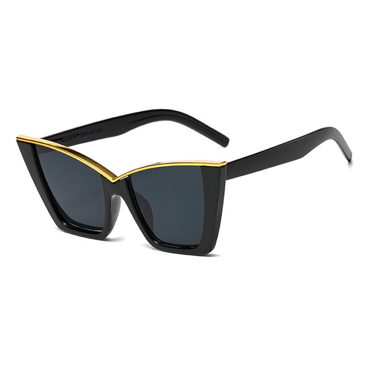 Dame ekstravagant solbrille med unik design og gullige aksenter Skanto