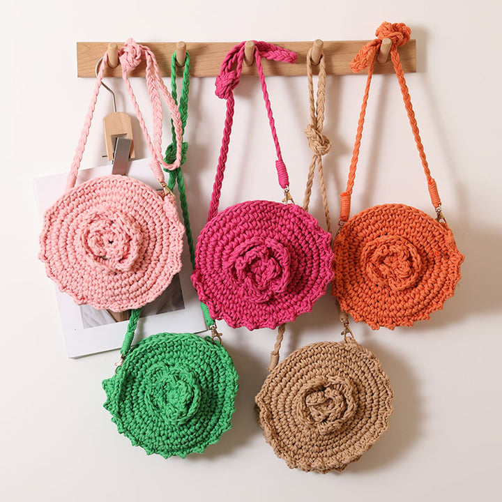 Håndheklede crossover-veske med florale detaljer Skanto