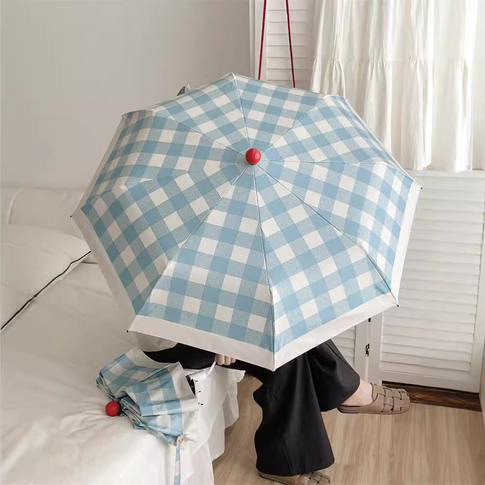 Dame sammenleggbart paraply med spesiell design Skanto