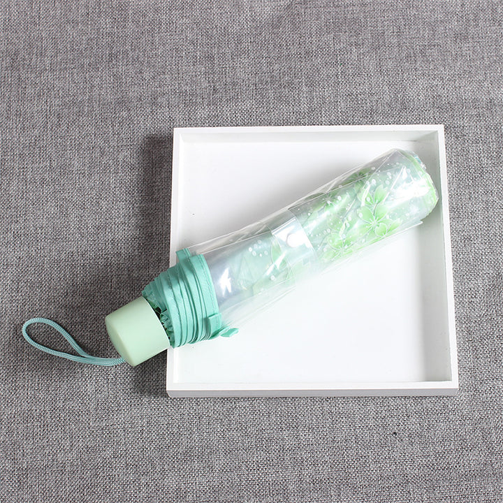 Damer elegant og bærbar paraply med blomsterdesign Skanto