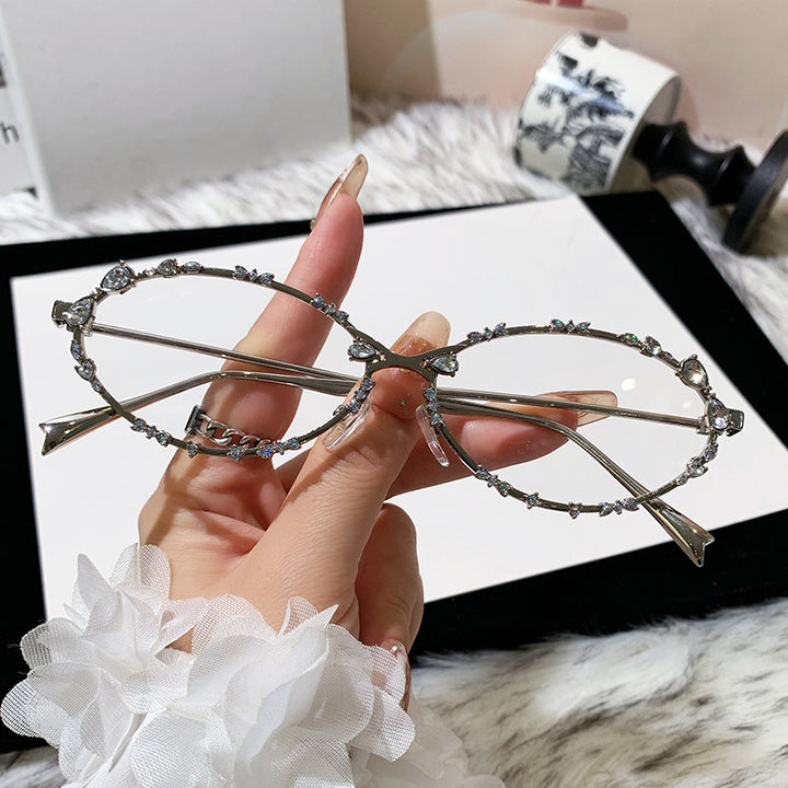 Dame eksklusiv solbrille med glitrende strass-dekor og elegant metallramme Skanto
