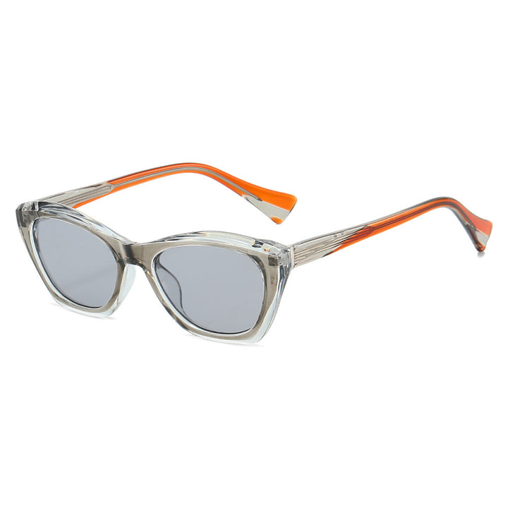Dame Cat-Eye solbriller med transparente og fargede detaljer Skanto