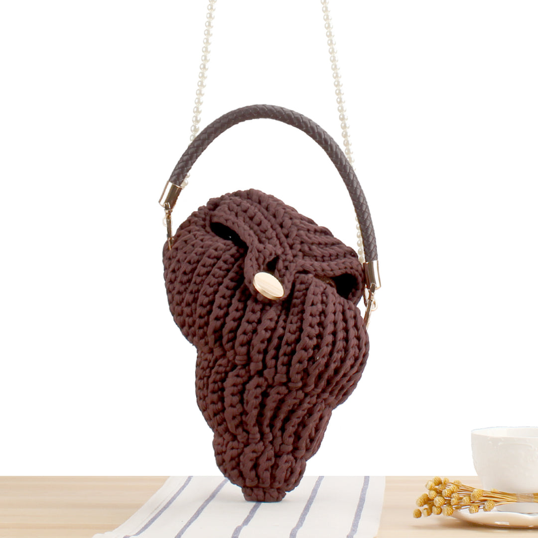 Elegant håndveske i muslingdesign Skanto