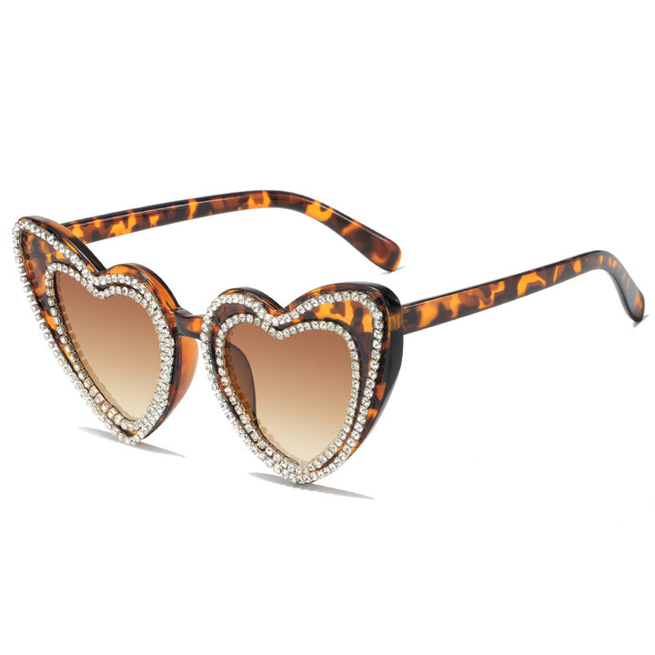 Dame hjerteformet solbrille med glitrende detaljer Skanto