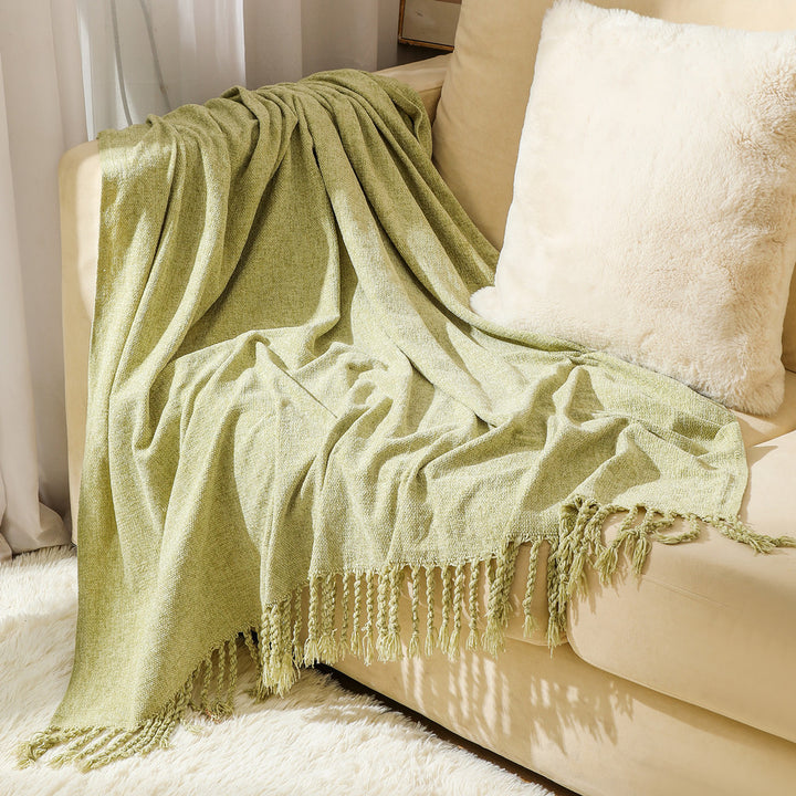 Kvinnelig elegant og stilfull sofa teppe med frynser Skanto