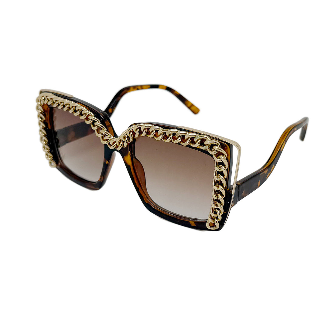 Dame moteriktig oversized solbrille med kjederamme Skanto