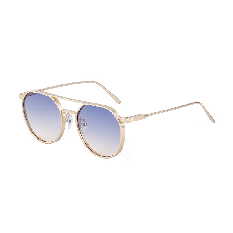 Dame moterik solbrille i stilfullt rundt design Skanto