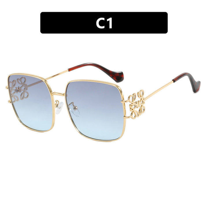 Dame kvadratisk solbrille med filigran design og luksuriøs metallramme Skanto
