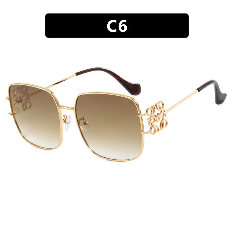 Dame kvadratisk solbrille med filigran design og luksuriøs metallramme Skanto