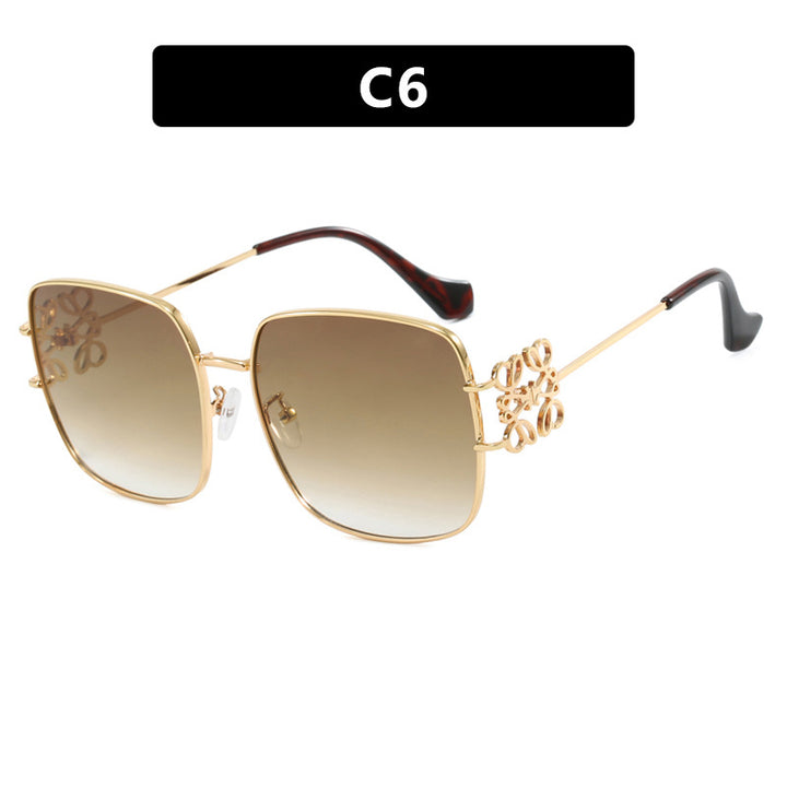Dame kvadratisk solbrille med filigran design og luksuriøs metallramme Skanto