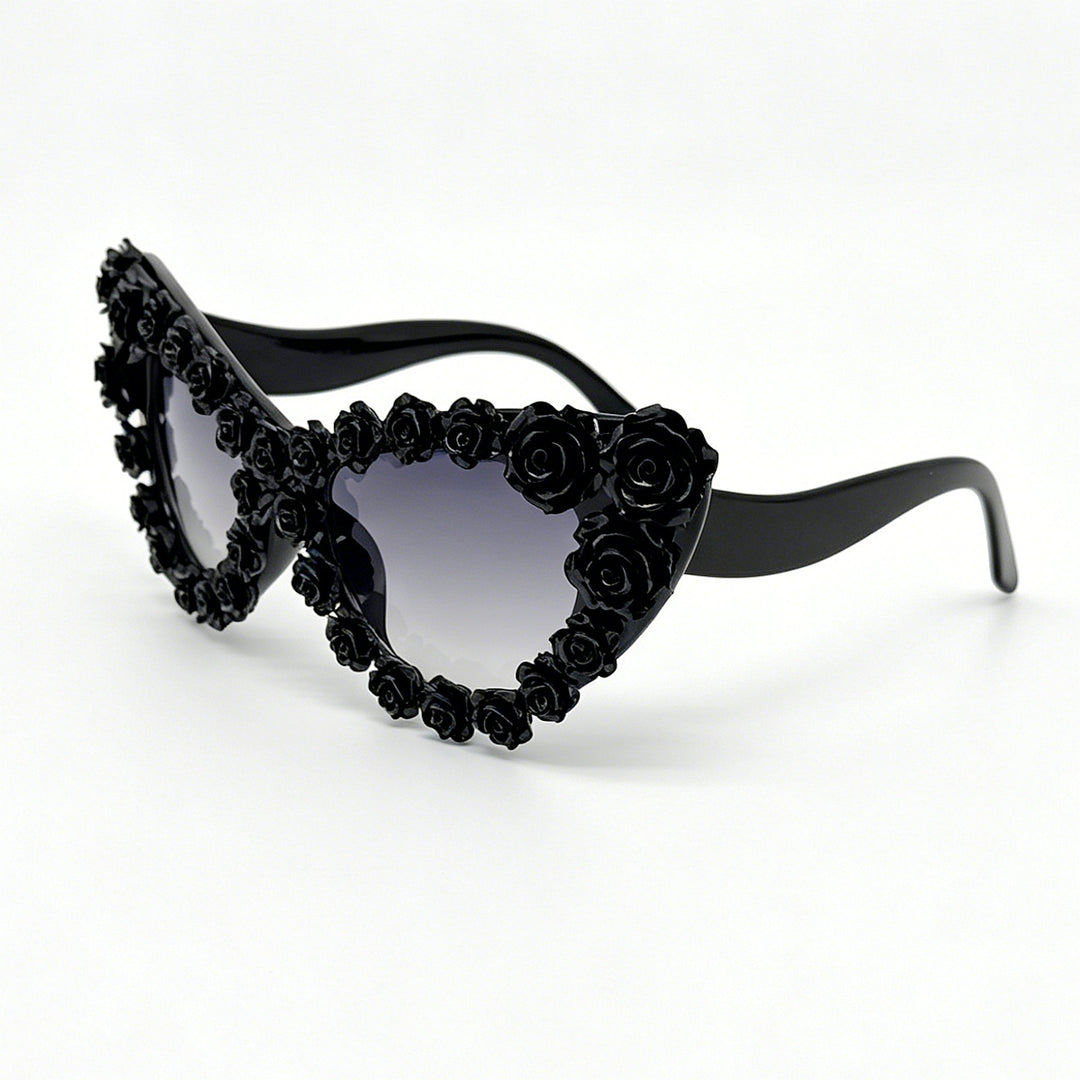 Damen hjerteformet solbrille med blomsterapplikasjon Skanto