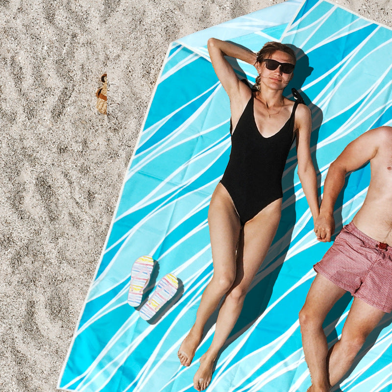 Stranddekken med fargerikt skilpadde-mønster Skanto