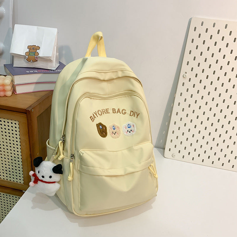 Dekorativ brodert skoleveske