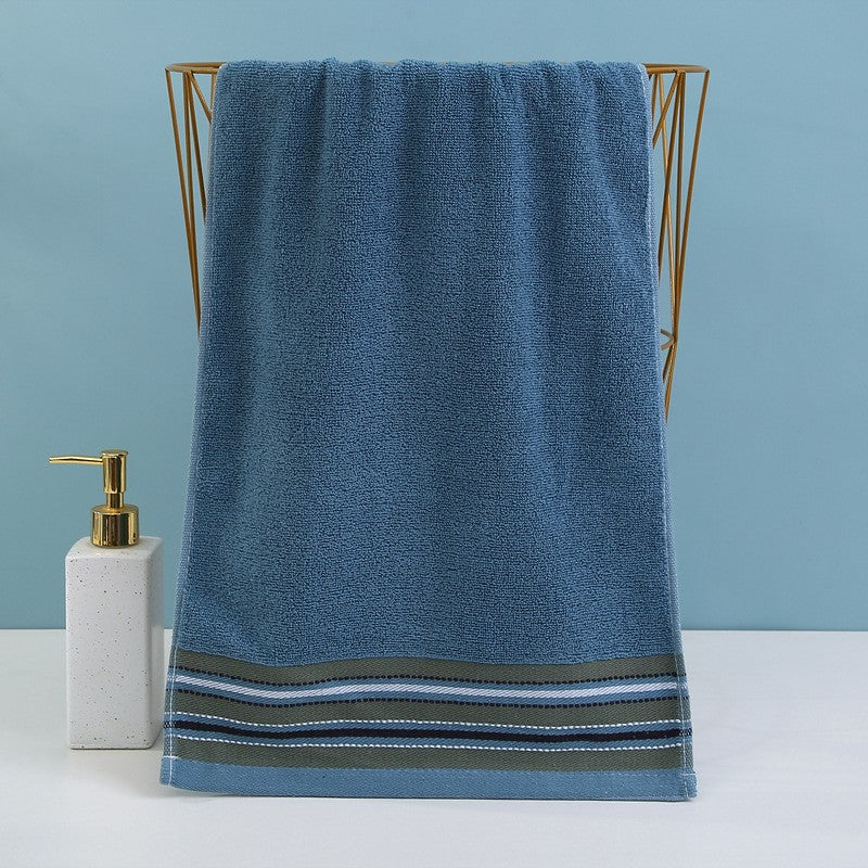 Premium terry towel with elegant stripe border.