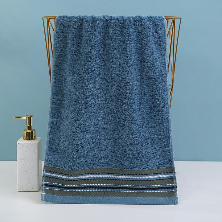 Premium terry towel with elegant stripe border.