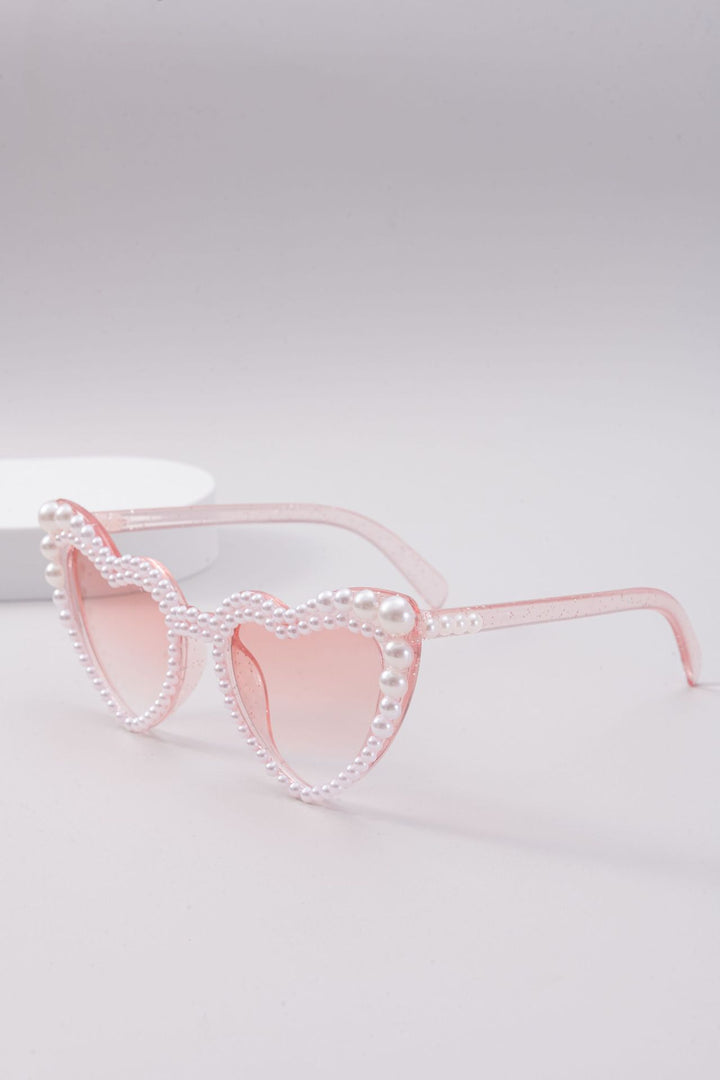 Dame designer solbrille med perleinnramming fra Skanto