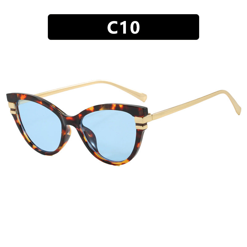 Dame Cat-Eye solbriller med elegant plastramme og gullaccentuer Skanto