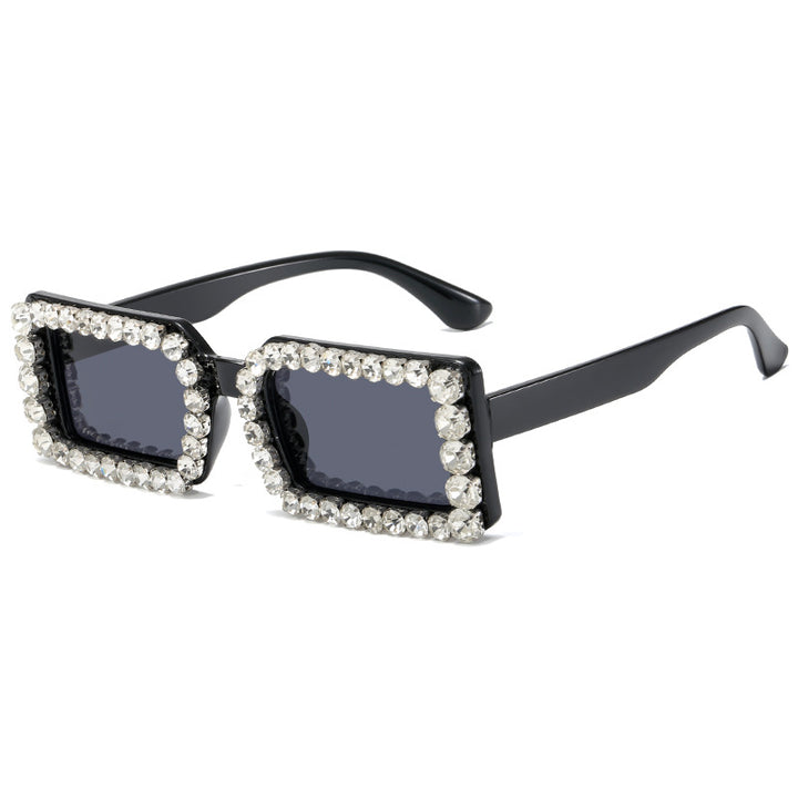 Dame moteriktig solbrille med glitrende rammedekorasjon Skanto