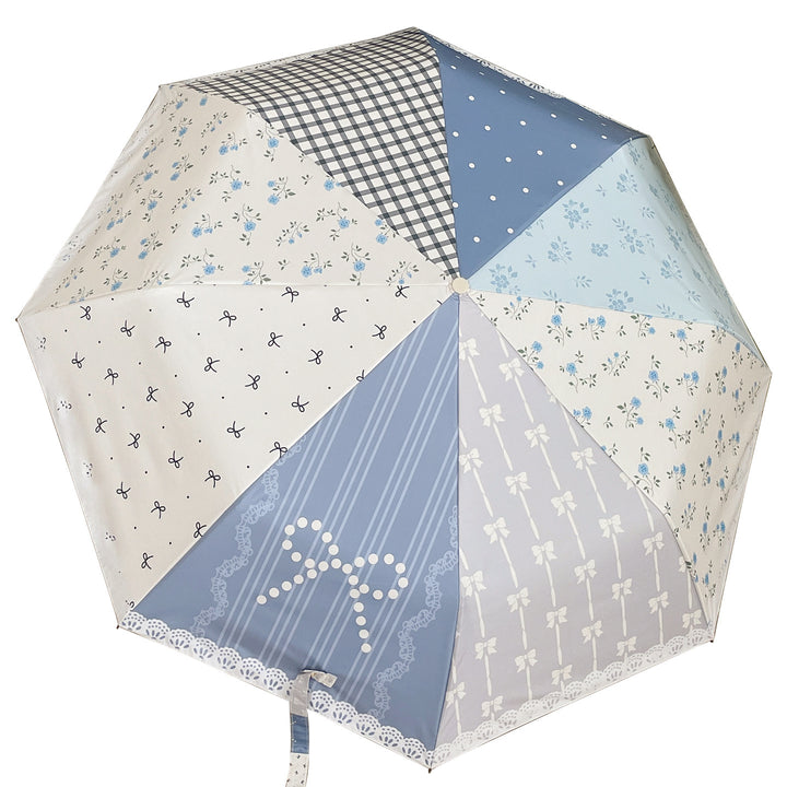 Damer paraply i romantisk patchwork-design Skanto