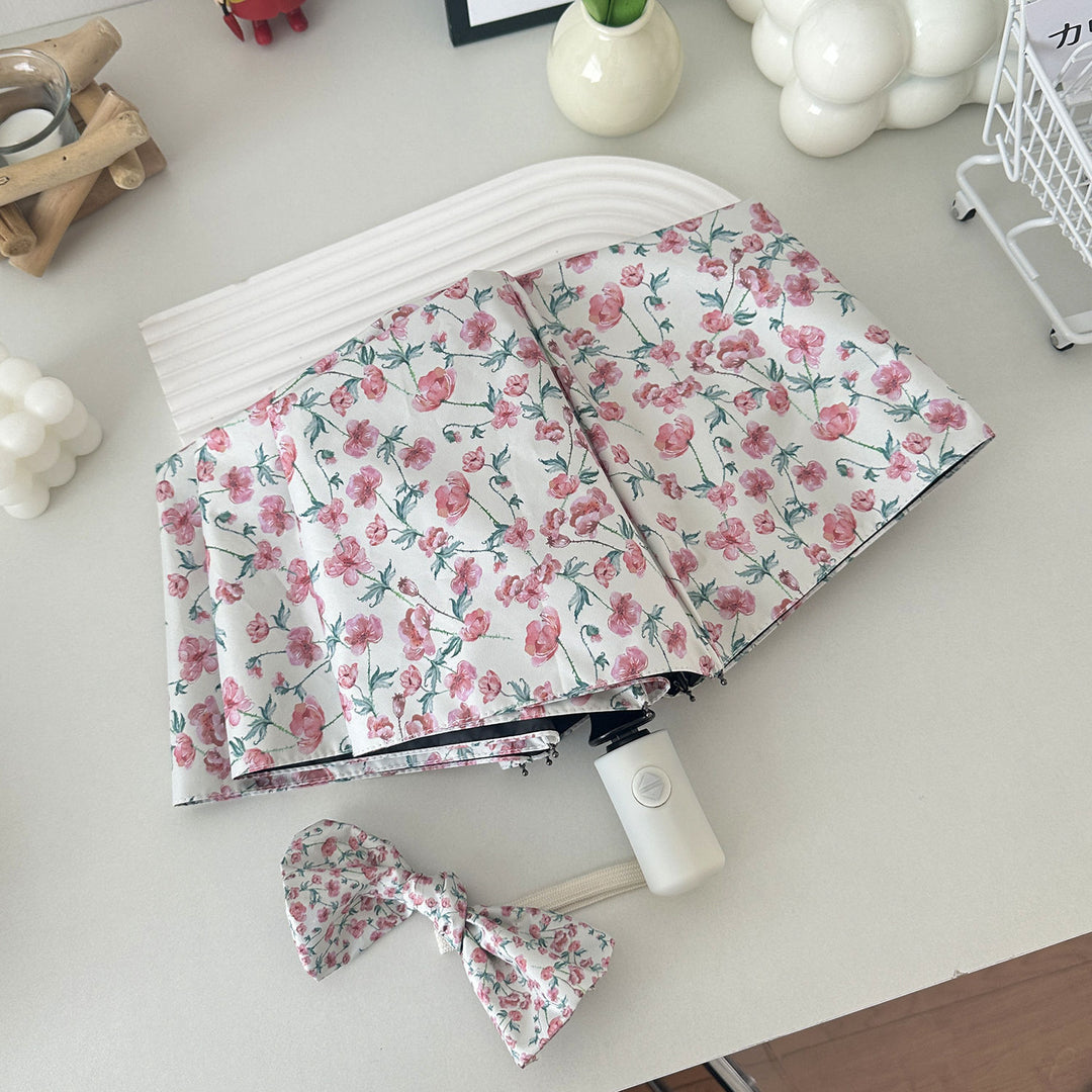 Dame sammenleggbare paraply med blomsterdesign og praktisk oppbevaringssystem Skanto