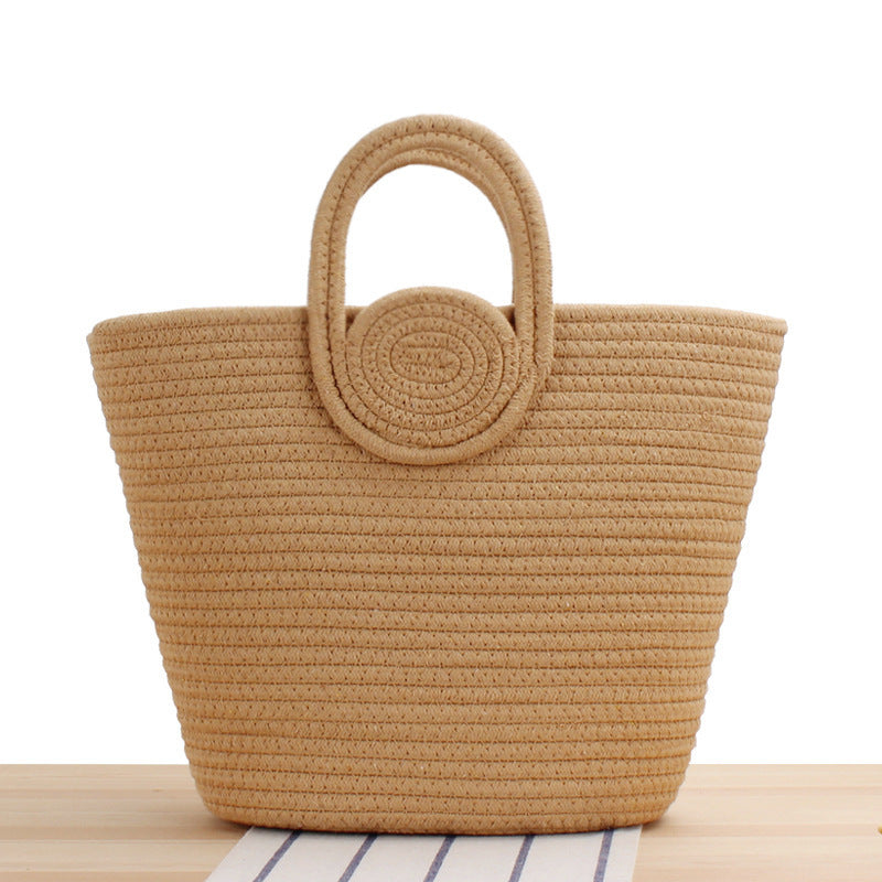 Modern handbag with playful pom-pom embellishments Skanto