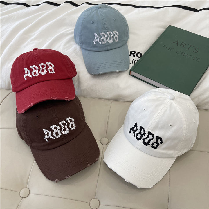 Kvinnens slitte bomull baseballcaps med grafisk detaljer Skanto
