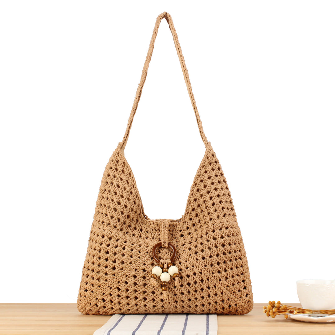 Handbag made of hand-knotted natural material with stylish fringe details Skanto