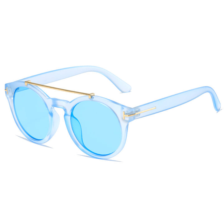 Dame fashionable solbriller med elegante runde glass Skanto