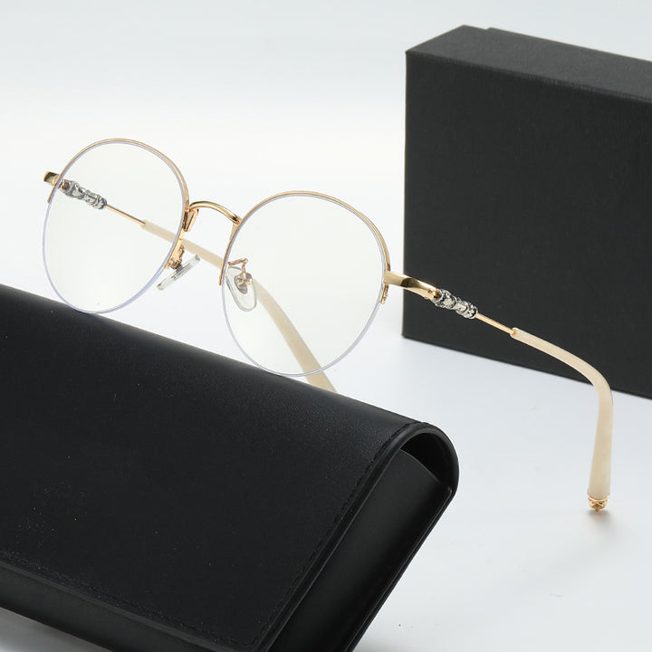 Dame rund solbrille med elegant metallramme og komfortable nesepads Skanto