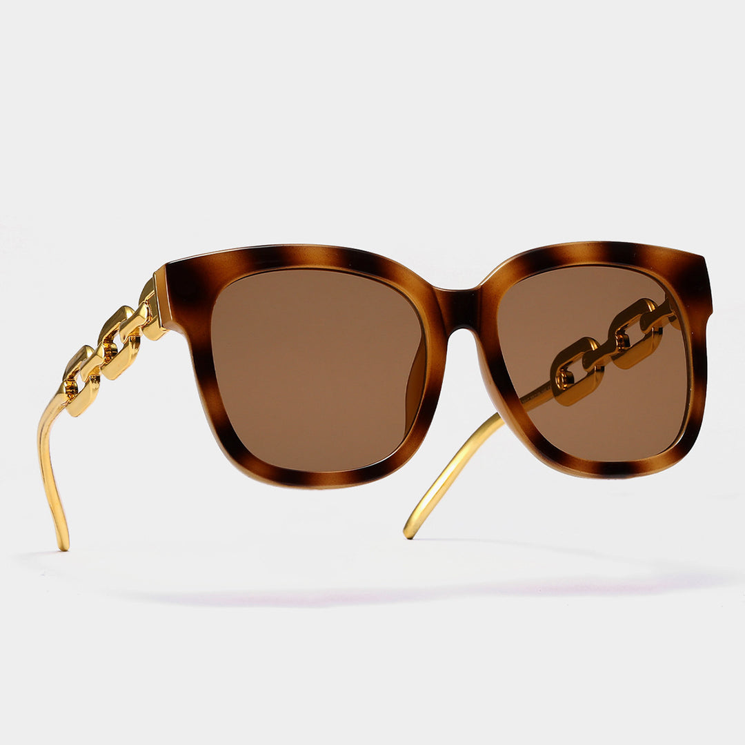 Dame moteriktig oversized solbrille med luksuriøs kjedeinnramming Skanto