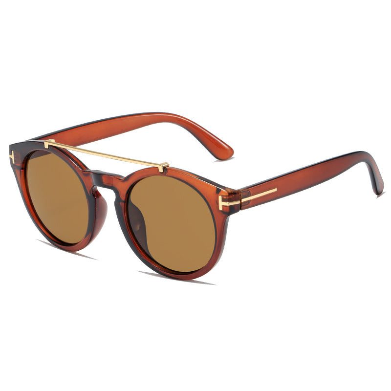 Dame fashionable solbriller med elegante runde glass Skanto