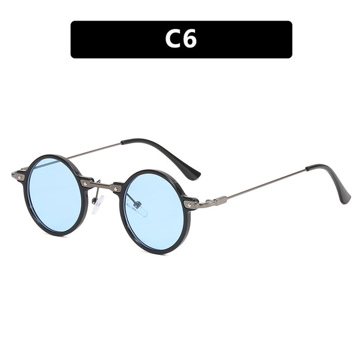 Dame rund solbrille med moderne metallramme og store blå linser Skanto