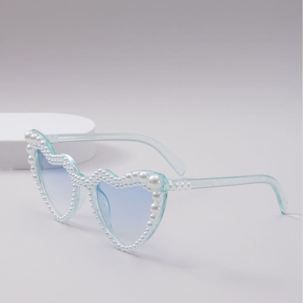 Dame designer solbrille med perleinnramming fra Skanto