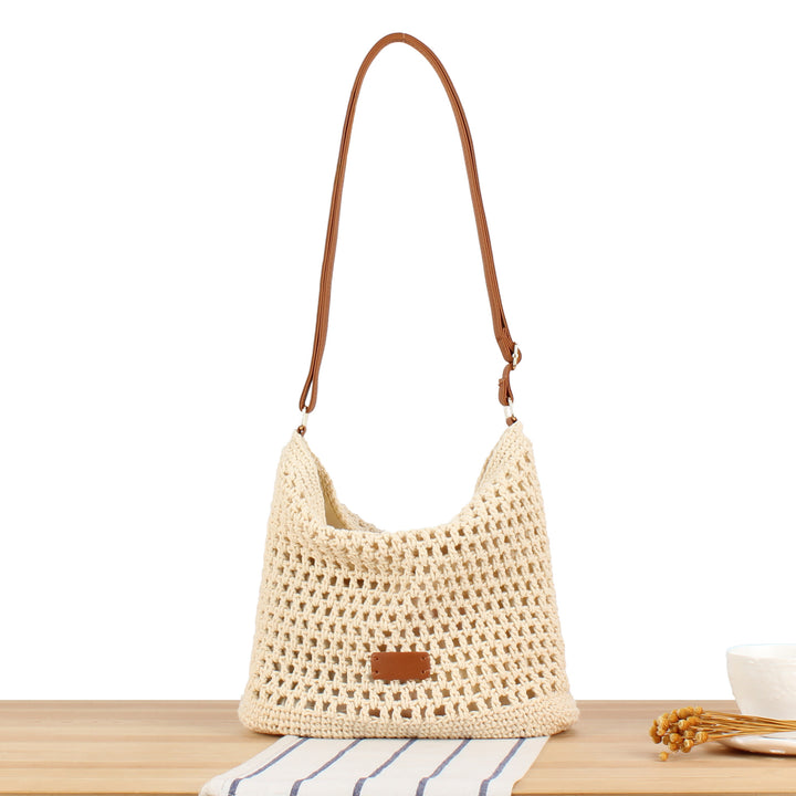 Handbag in hand-woven natural material with leather accents Skanto