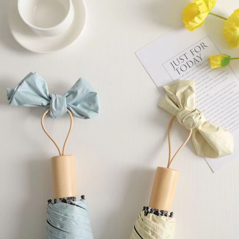 Dame elegant klappparaply med innovativ design Skanto