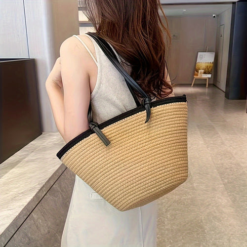 Romslig strandveske laget av flettet materiale Skanto