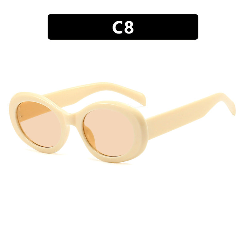 Dame moteriktig solbrille i original oval design med transparent ramme og UV-beskyttelse Skanto
