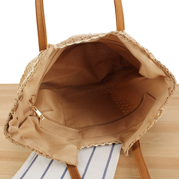 Tote bag made of woven natural material with elegant leather handles Skanto