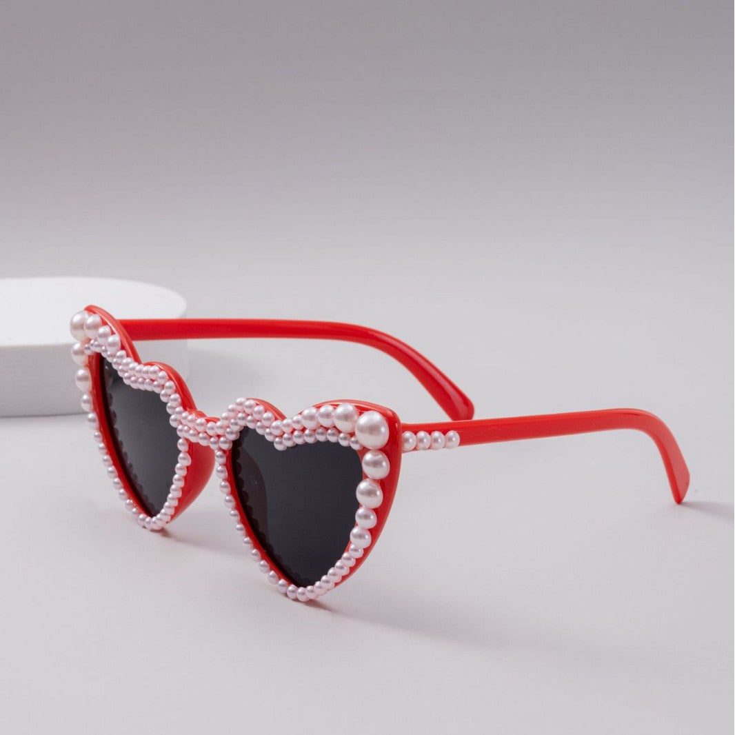 Dame designer solbrille med perleinnramming fra Skanto