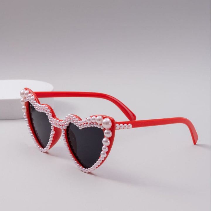 Dame designer solbrille med perleinnramming fra Skanto