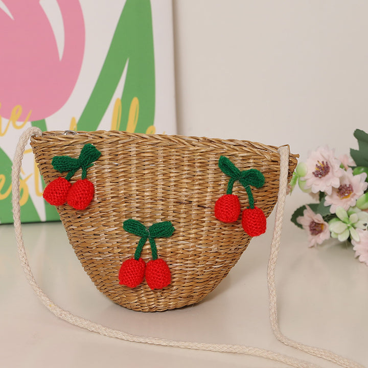 Lekenete bast-skulderveske med florale aksenter Skanto