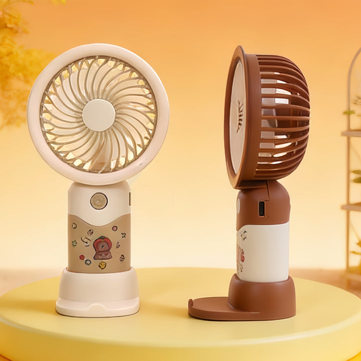 Dame portable håndvifte med ergonomisk design og søtt motiv Skanto